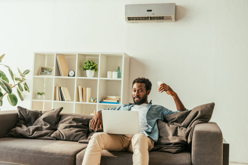 rsz handsome african man using laptop while sitting on 2023 11 27 05 00 55 utc